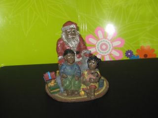   Claus with Two Children Waiting for Santa on Christmas Eve Figurine