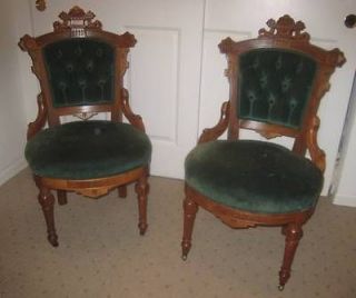 Pair Victorian Eastlake walnut pull up parlor chairs, green velvet.