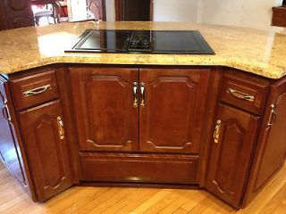 KITCHEN ISLAND WITH GRANITE COUNTERTOP AND ELECTRIC COOKTOP