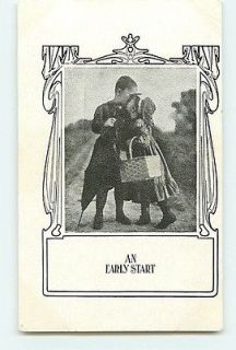   Little Boy and Girl Kissing An Early Start c1905 Basket Umbrella