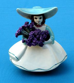 Lady Figurine with White Dress holding Purple Flowers
