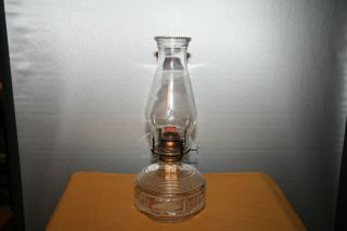 Clear glass oil lamp or lantern with wick and globe