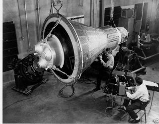 Engineers inspect and test a boilerplate Mercury space capsule Mercury 