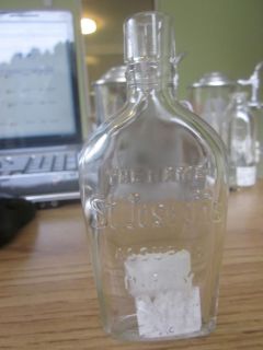 ANTIQUE GLASS BOTTLE THE NAME ST. JOSEPHS ASSURES PURITY FLAT SMALL 