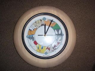 warner brothers with looney toon characters wall clock time left