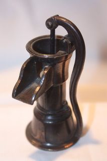 vintage copper die cast water pump pencil sharpener  