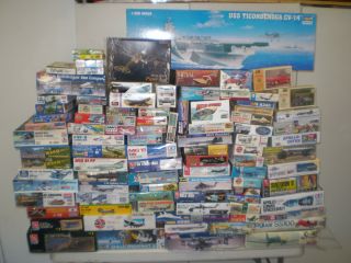 Large lot of model aircraft, heli kits and decals. 100 plus