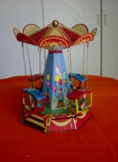 Antique Vintage Repo Tin Metal Wind Up Carousel Toy made by Wagner 