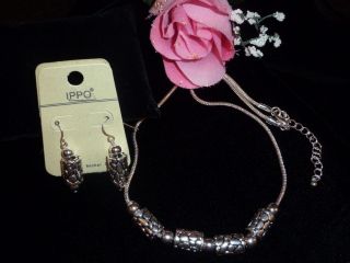 ARTISTIC STYLED NECKLACE & EARRING SET:offered by brighton bay premier 