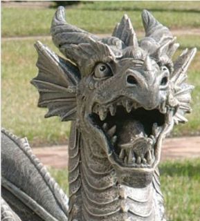   intricately sculpted dragon statue stretched out over two feet long in