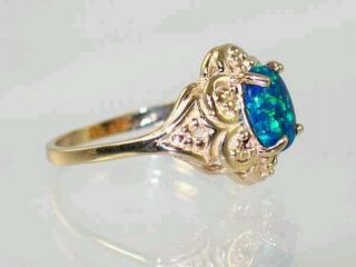 The stone is a unique Created Blue/ Green Opal; Bright Green Opal 
