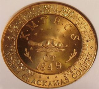 the obverse has a replica of the beaver $ 10 gold piece and reads 
