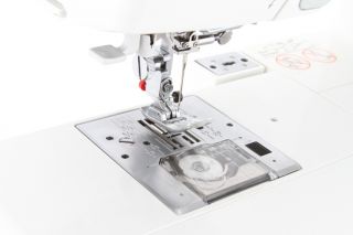   looking at a pristine Janome Memory Craft Sewing & Embroidery Machine