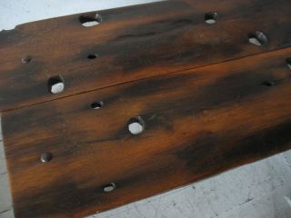 unusual organic exotic wood cocktail table bench with solid cast iron 