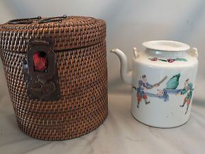 UNUSUAL CHINESE KETTLE PAINTED WITH FIGURES IN A WICKER CONTAINER 