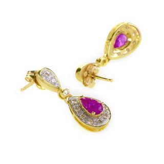 This pair of drop earrings are colorful and bright. They are made of