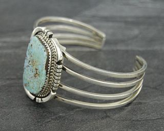 Description Sterling Silver Bracelet set with a Dry Creek Turquoise