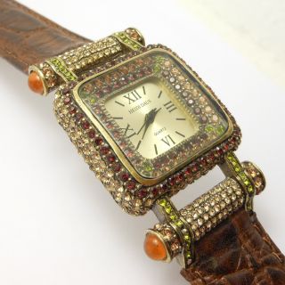 This is a beautiful watch by designer Heidi Daus. Signed on face