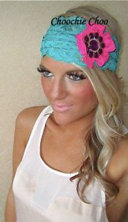 Green wide lace hair band, with a pink lace flower and purple diamante
