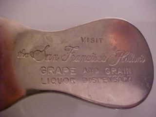 This is a vintage bottle opener and shoehorn combo stamped visit the