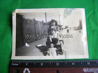 PHOTO D0107 GIRLS SITTING IN SMALL WAGON,LARGE DOLL IN FRONT