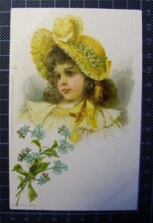 1900s BRUNDAGE Brown Eyed Girl with yellow feathered bonnet, Forget