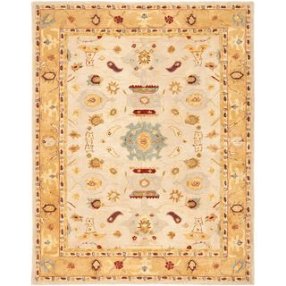 Handmade Tribal Ivory/ Gold Wool Rug (96 X 136) (IvoryPattern: OrientalMeasures 0.625 inch thickTip: We recommend the use of a non skid pad to keep the rug in place on smooth surfaces.All rug sizes are approximate. Due to the difference of monitor colors,