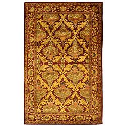 Handmade Kerman Wine/ Gold Wool Rug (5 X 8) (RedPattern: OrientalMeasures 0.625 inch thickTip: We recommend the use of a non skid pad to keep the rug in place on smooth surfaces.All rug sizes are approximate. Due to the difference of monitor colors, some 