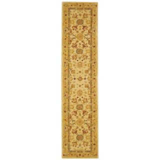 Handmade Heirloom Ivory/ Gold Wool Runner (23 X 12) (IvoryPattern: OrientalMeasures 0.625 inch thickTip: We recommend the use of a non skid pad to keep the rug in place on smooth surfaces.All rug sizes are approximate. Due to the difference of monitor col
